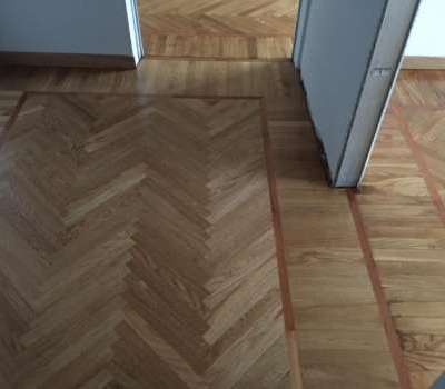 Posa e verniciatura parquet spinato in rovere